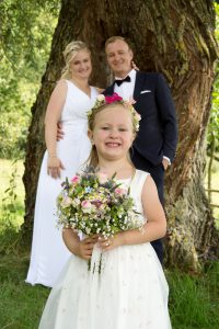 Hochzeitsfotografie Brautpaar mit Tochter
